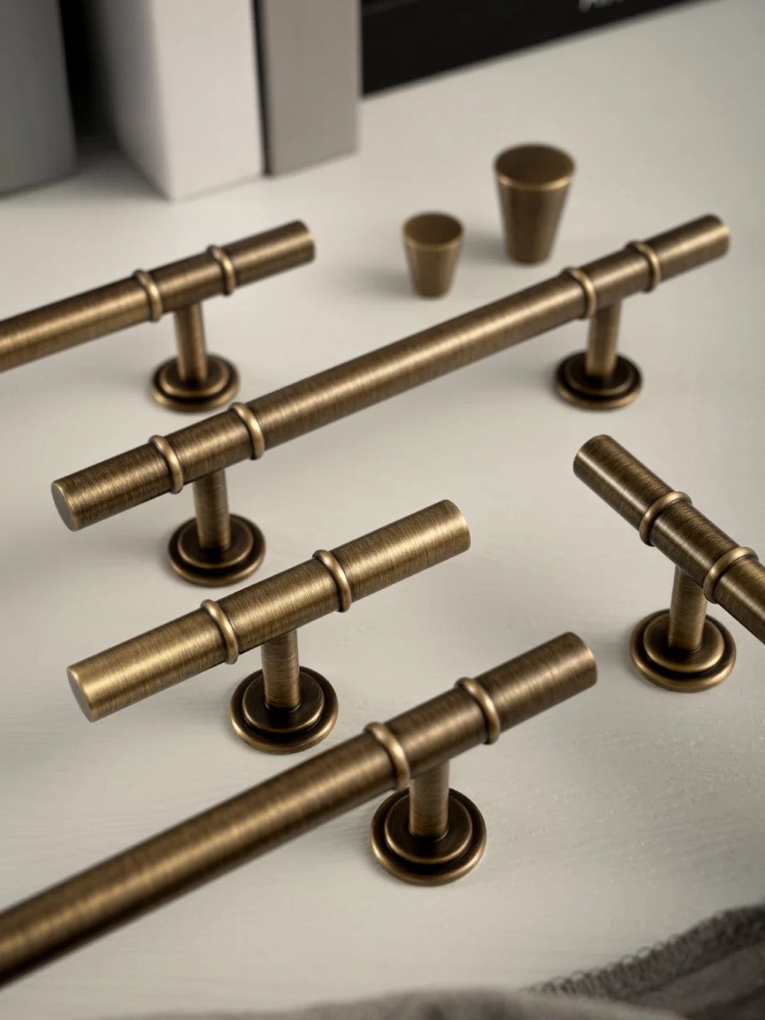 Set of bronze cabinet handles on a light background