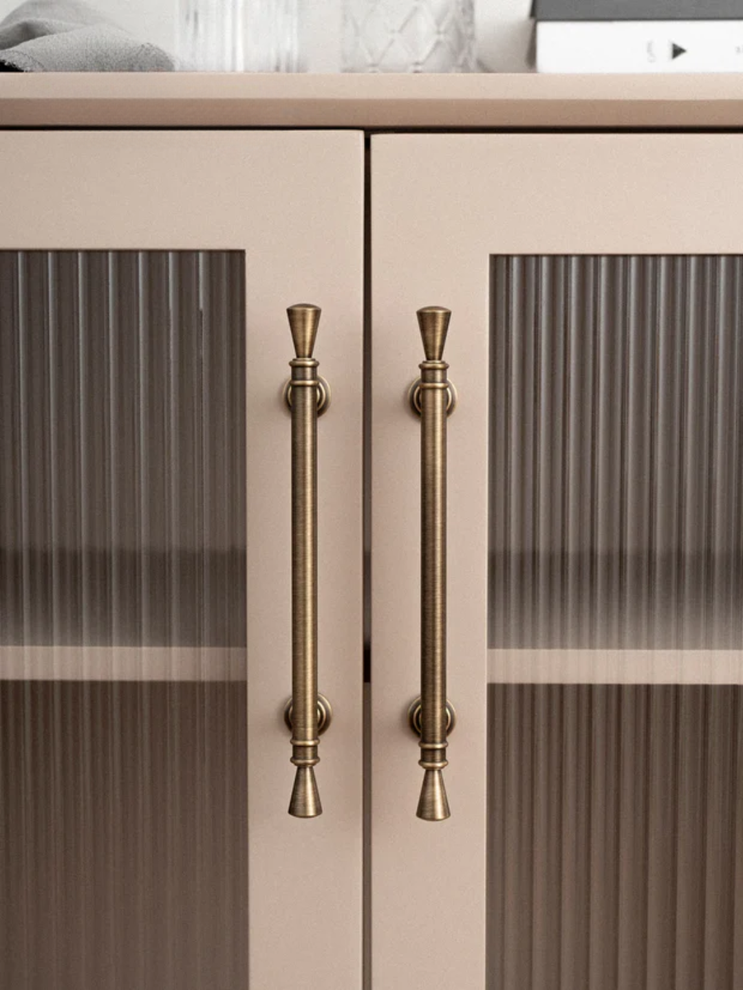 Cabinet with bronze handles