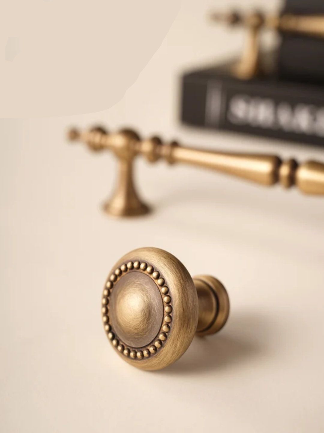 Brass door handle and knob on a neutral background.