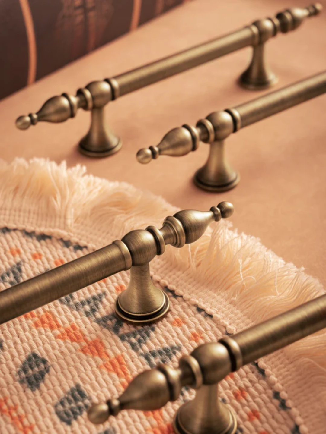 Close-up of decorative brass handles on a textured surface