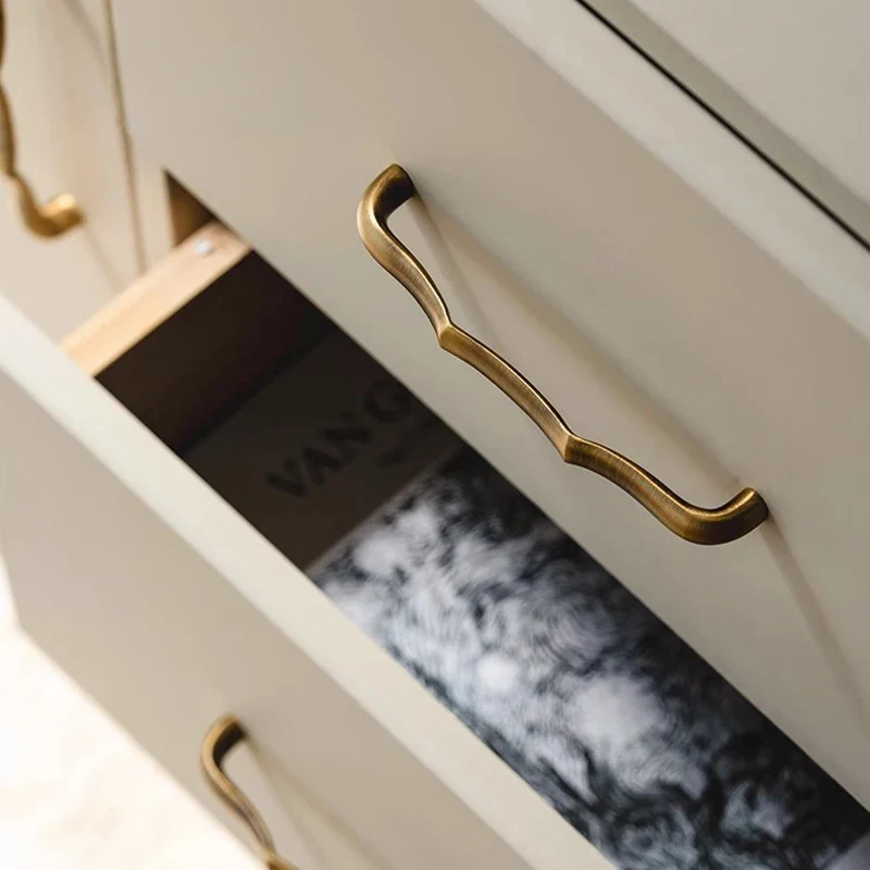 Close-up of a drawer with gold handle and Vanier branding.