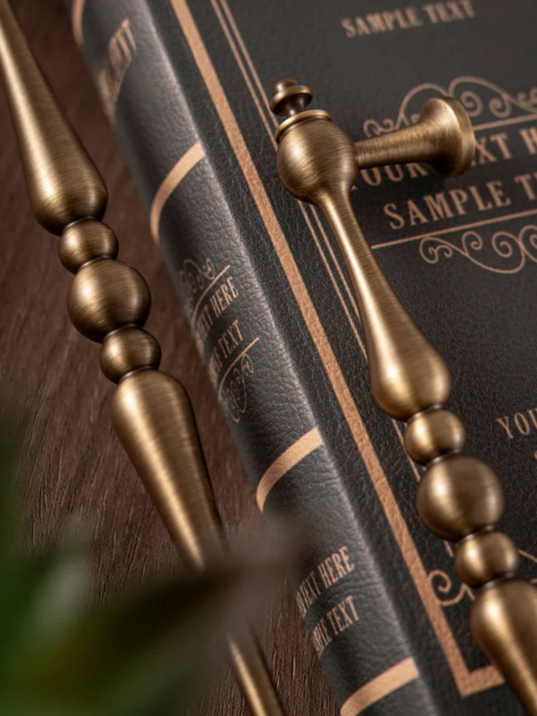 Decorative book with gold accents and a metallic object on top