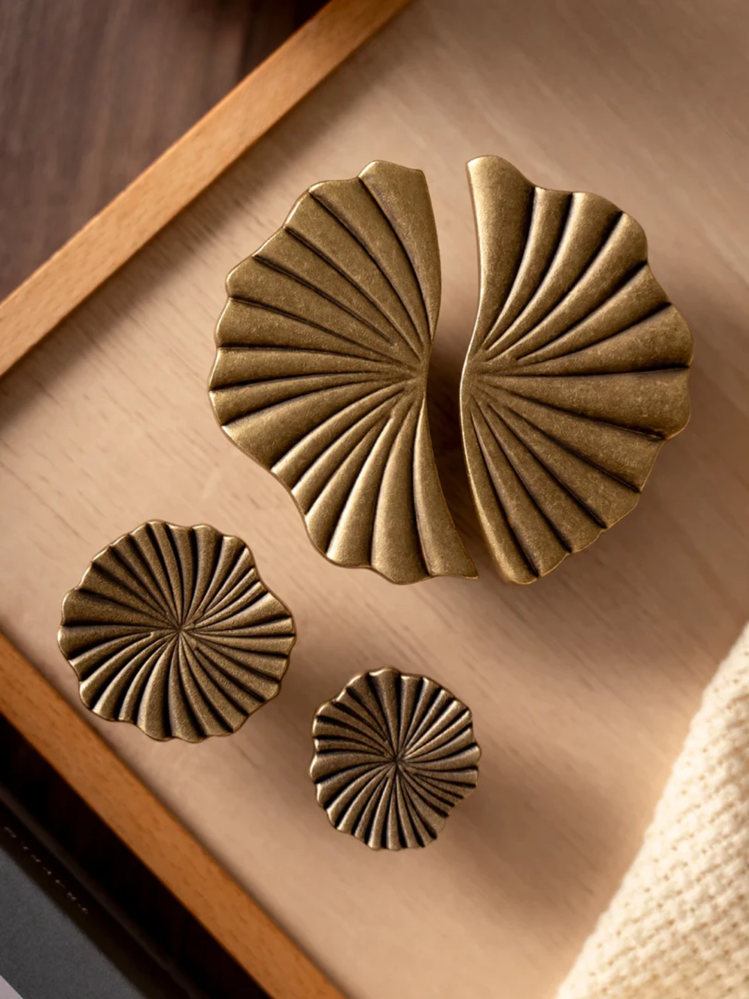 Set of bronze decorative elements on a wooden surface