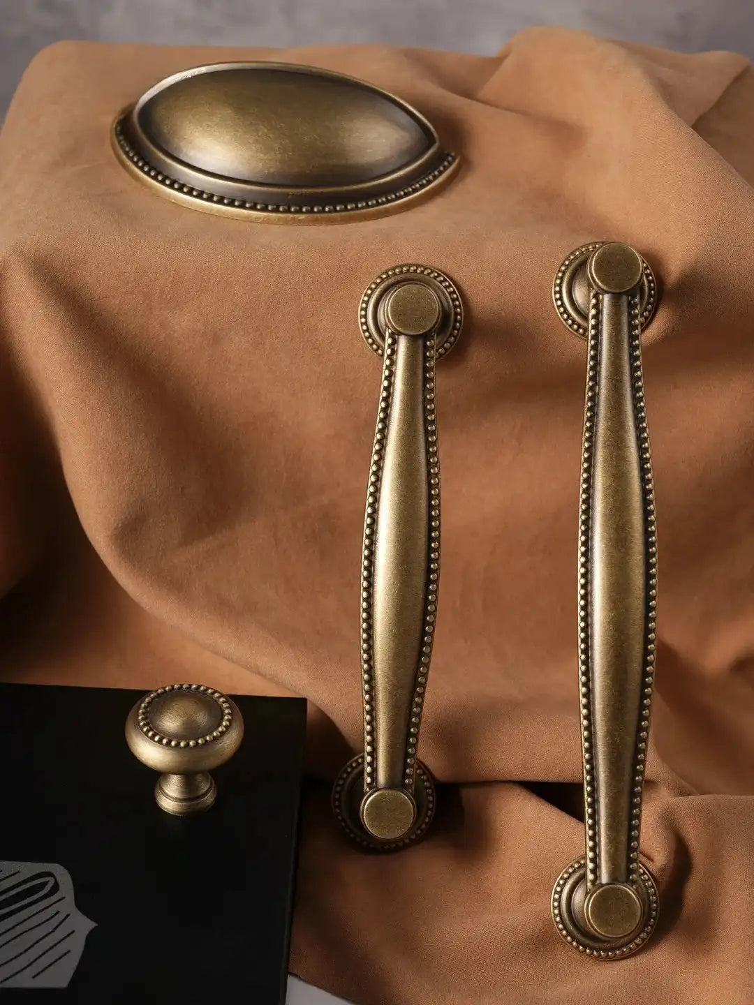 Brass hardware on a brown leather surface