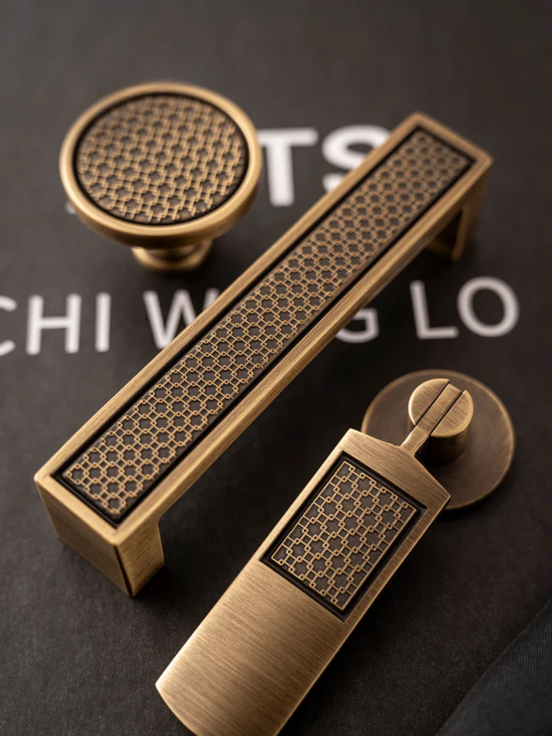 Set of bronze cabinet handles on a dark background