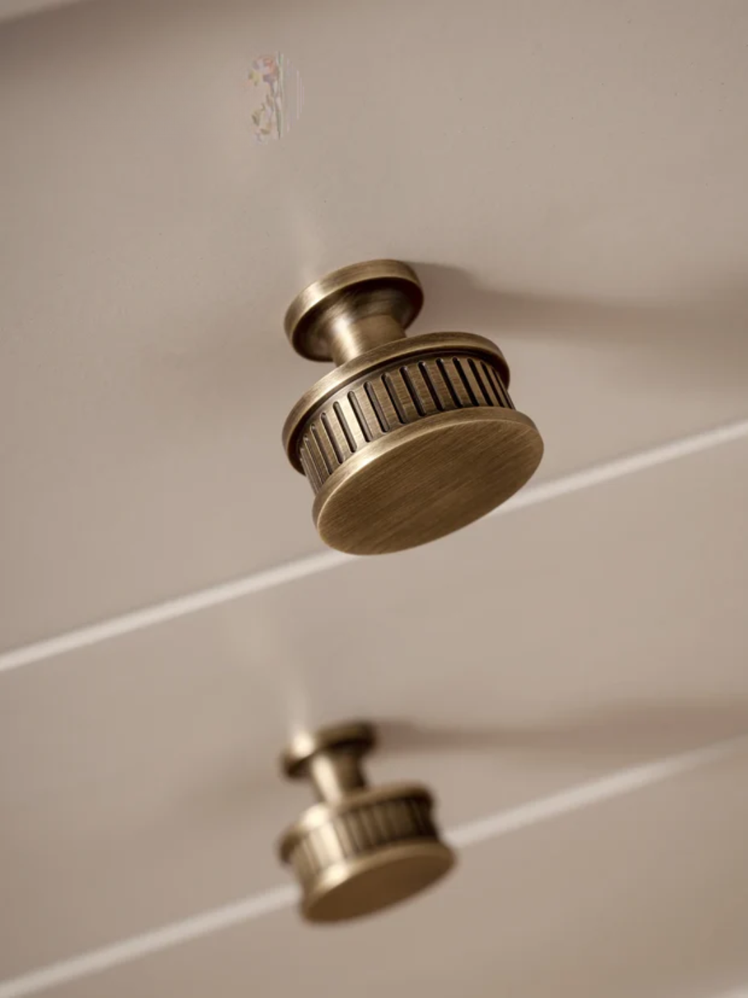 Brass ceiling fixture on a white ceiling.