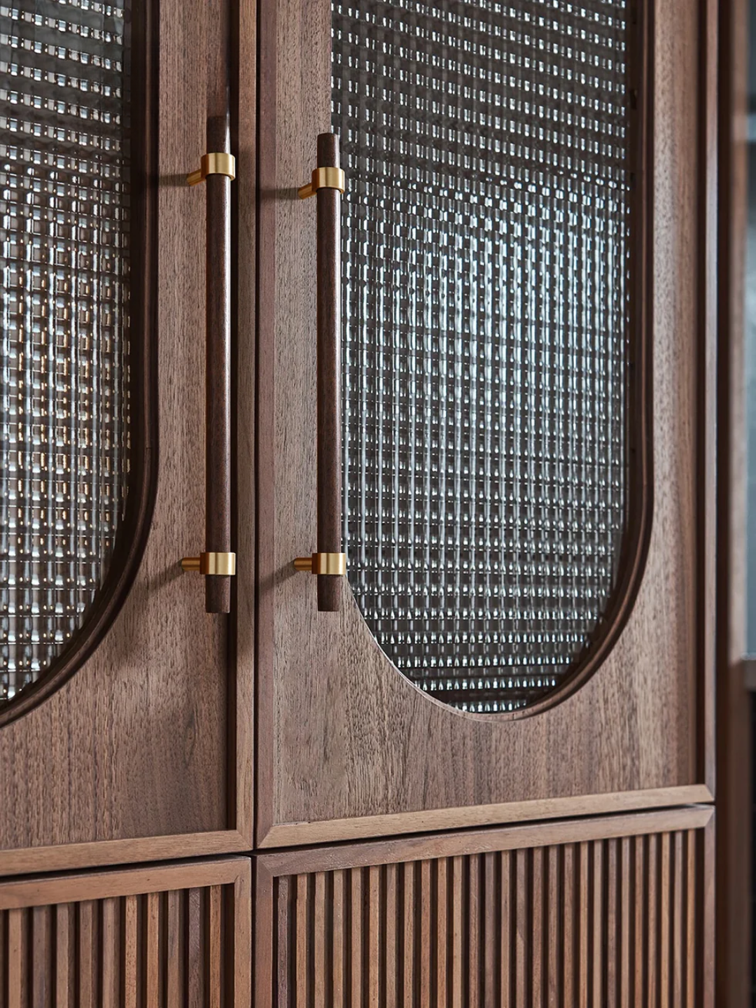 Wooden cabinet with glass panels and decorative handles