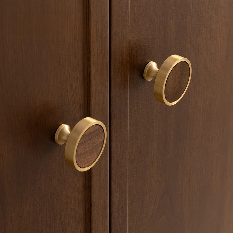 Wooden cabinet doors with gold round handles
