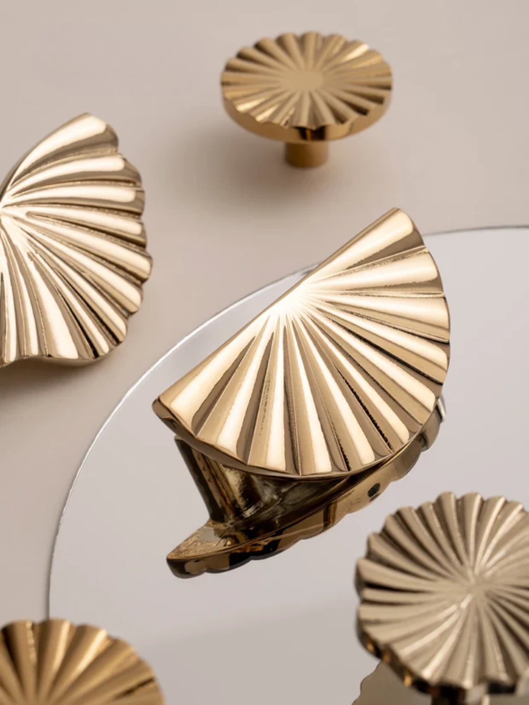 Decorative gold wall hooks with a mirror on a beige background, featuring the brand 'Santaya'.