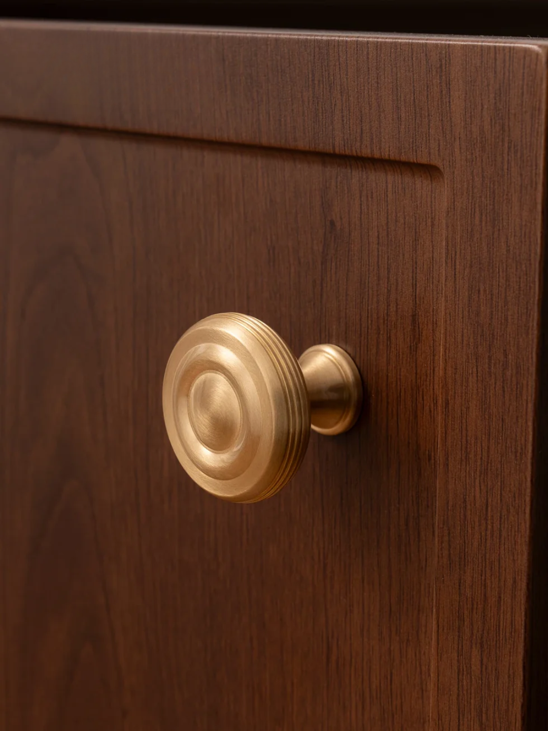 Gold door handle on a wooden door