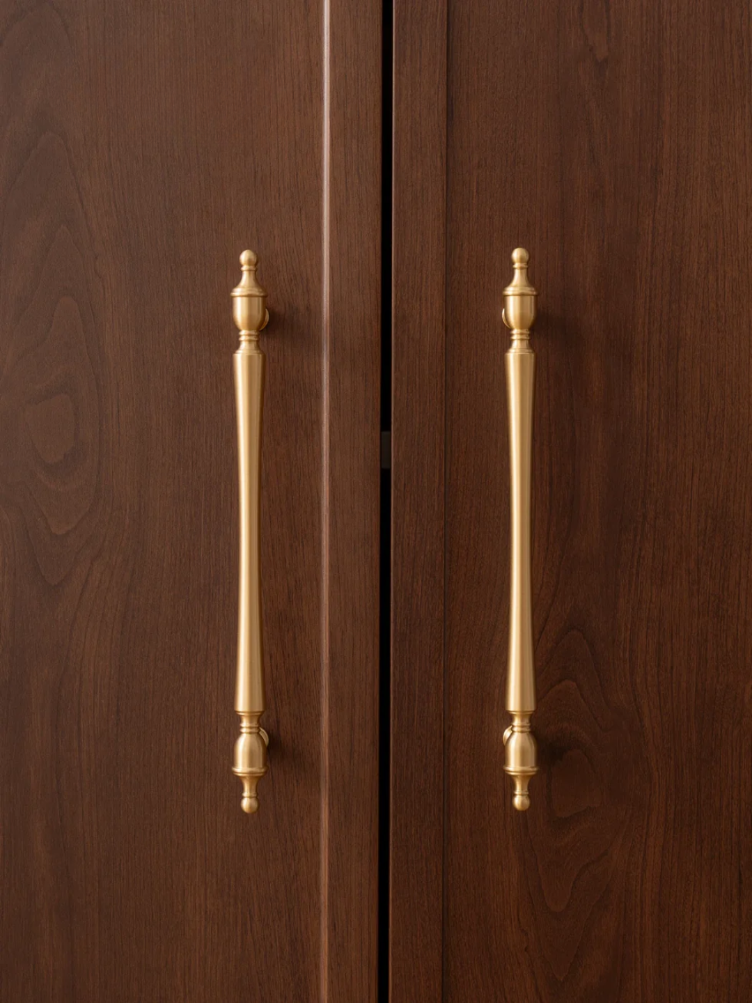 Wooden cabinet doors with gold handles