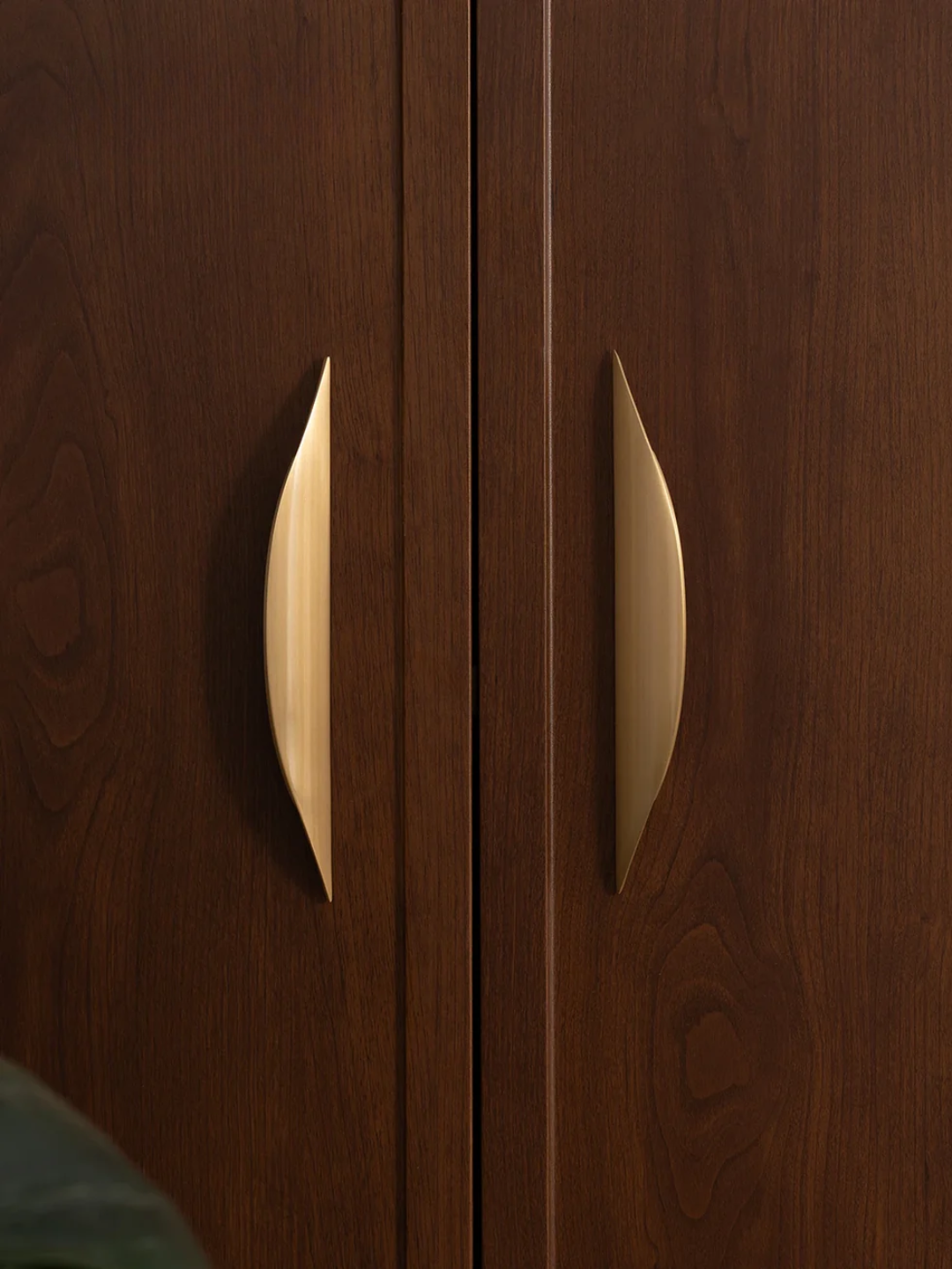 Wooden wardrobe with gold handles
