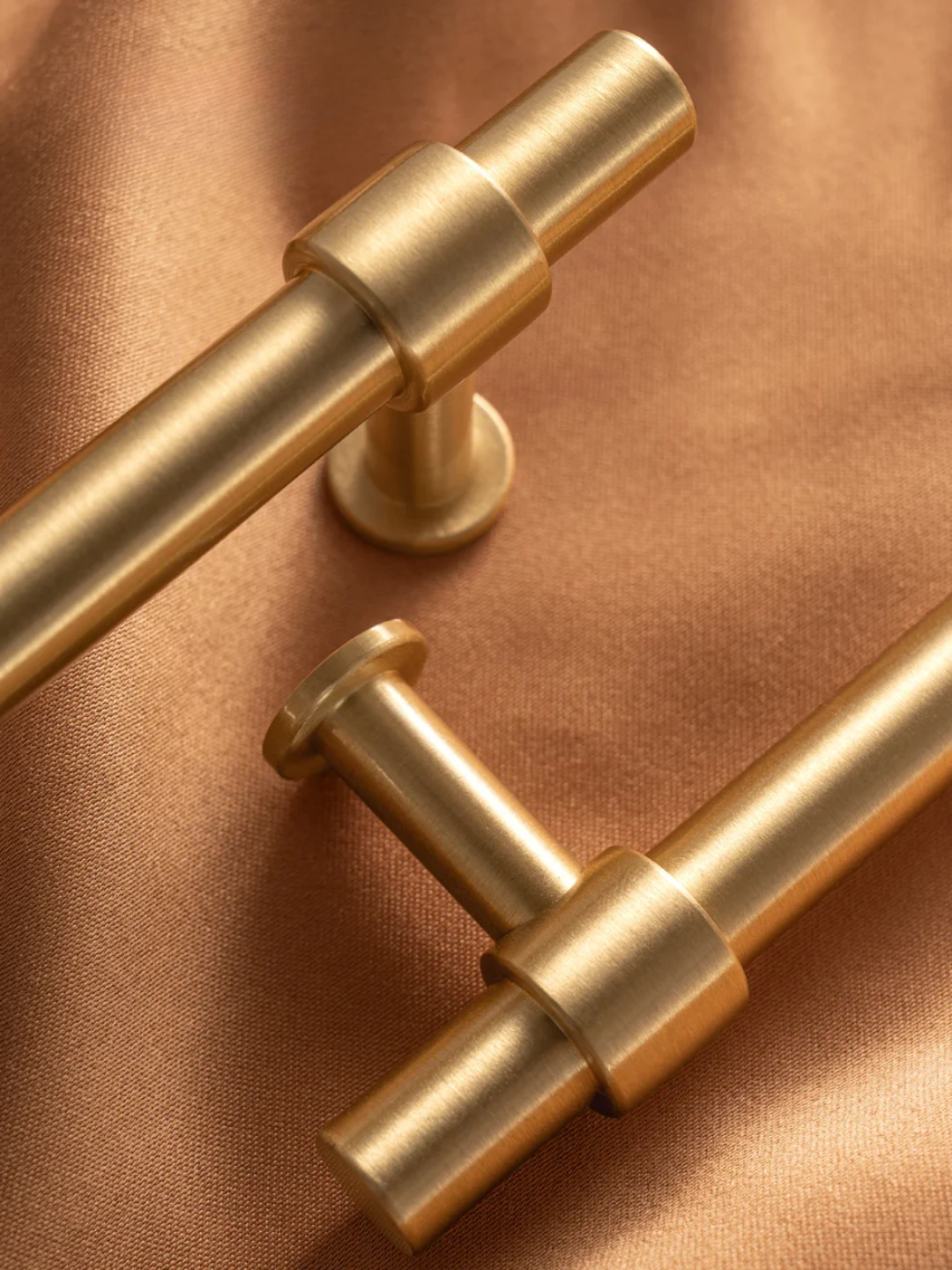 Two gold handles on a bronze background