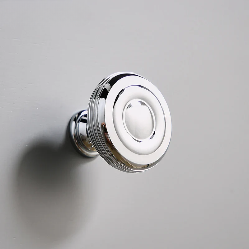 Chrome door handle on a gray background with 'SANTAYA' branding.