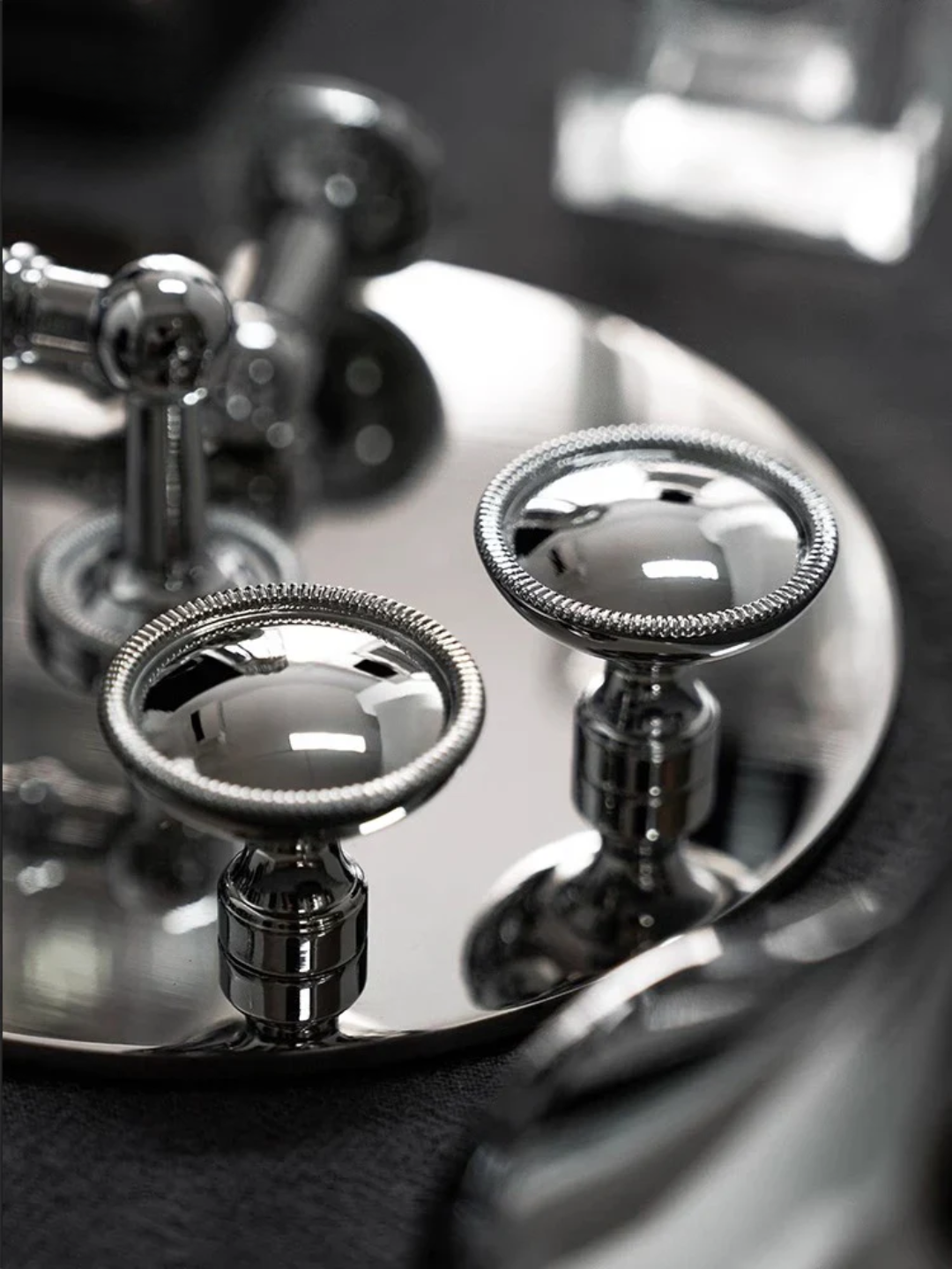 Close-up of a metallic object with 'Santaya' branding on a dark background