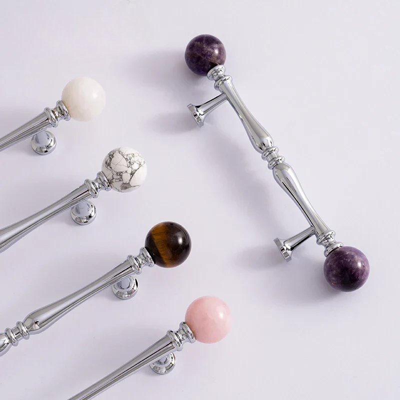 Decorative sticks with gemstone beads on a white background
