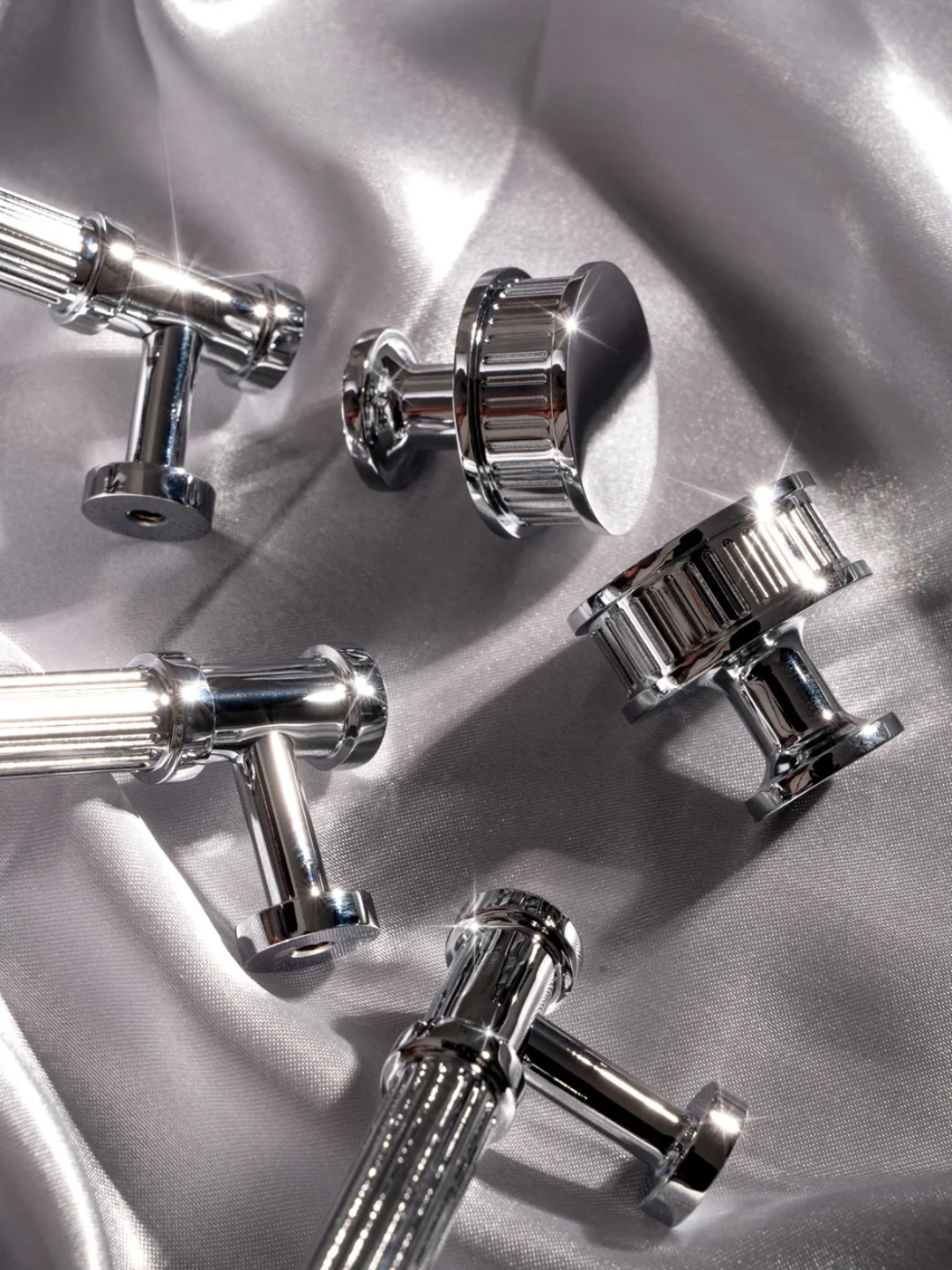 Silver knobs on a textured silver background