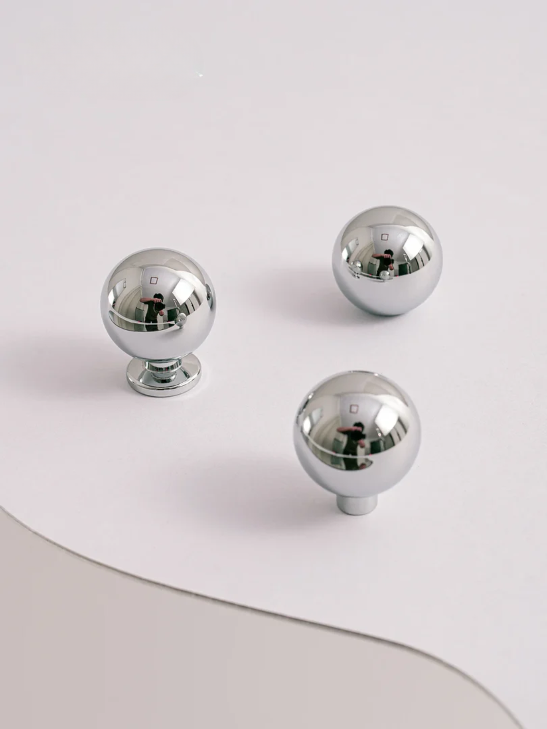 Silver knobs on a white background
