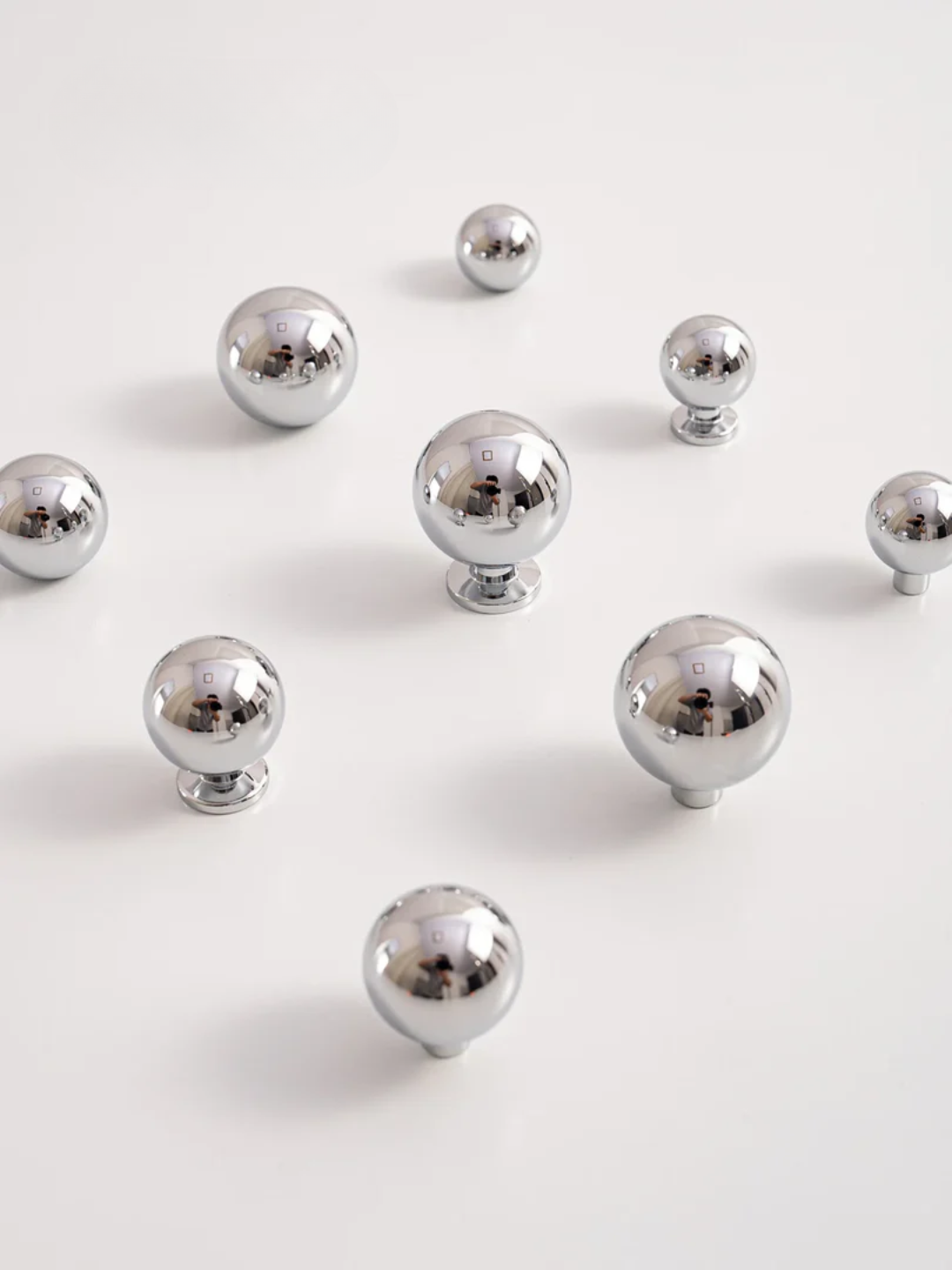 Silver knobs on a white background
