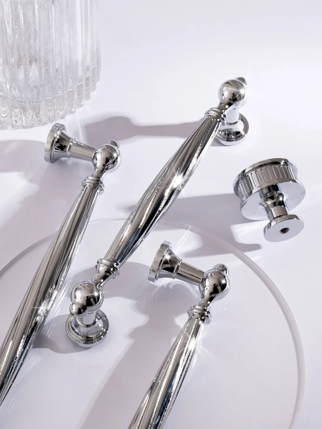 Set of silver cabinet handles on a white background