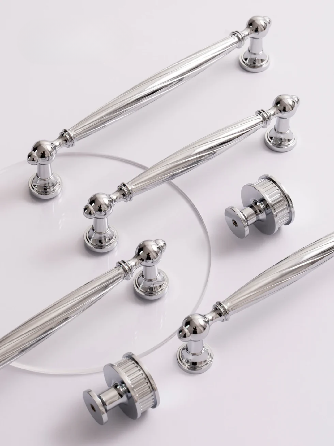 Set of silver cabinet handles on a white background