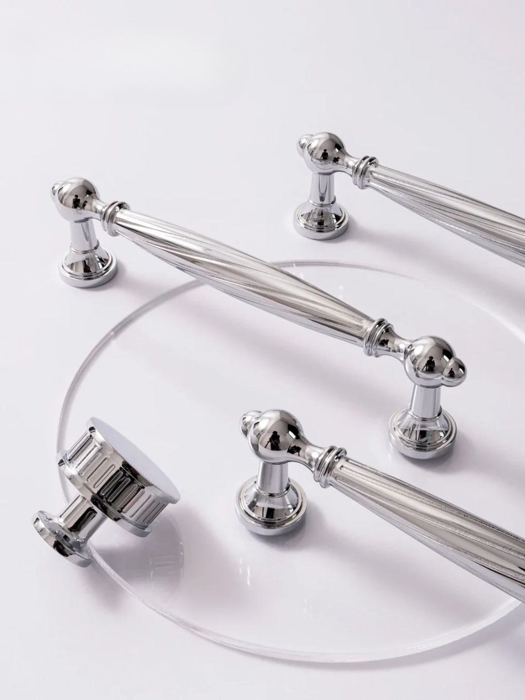 Set of silver bathroom fixtures on a white background
