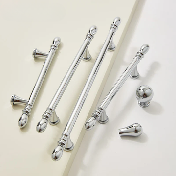 Set of silver curtain rods with decorative finials on a light background