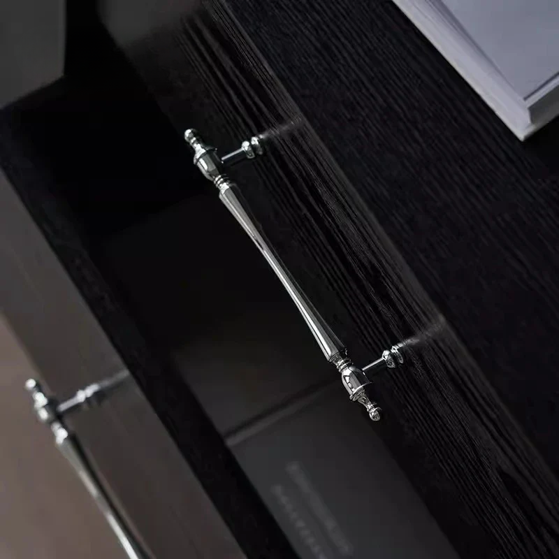 Close-up of a shower head with water flowing on a dark background