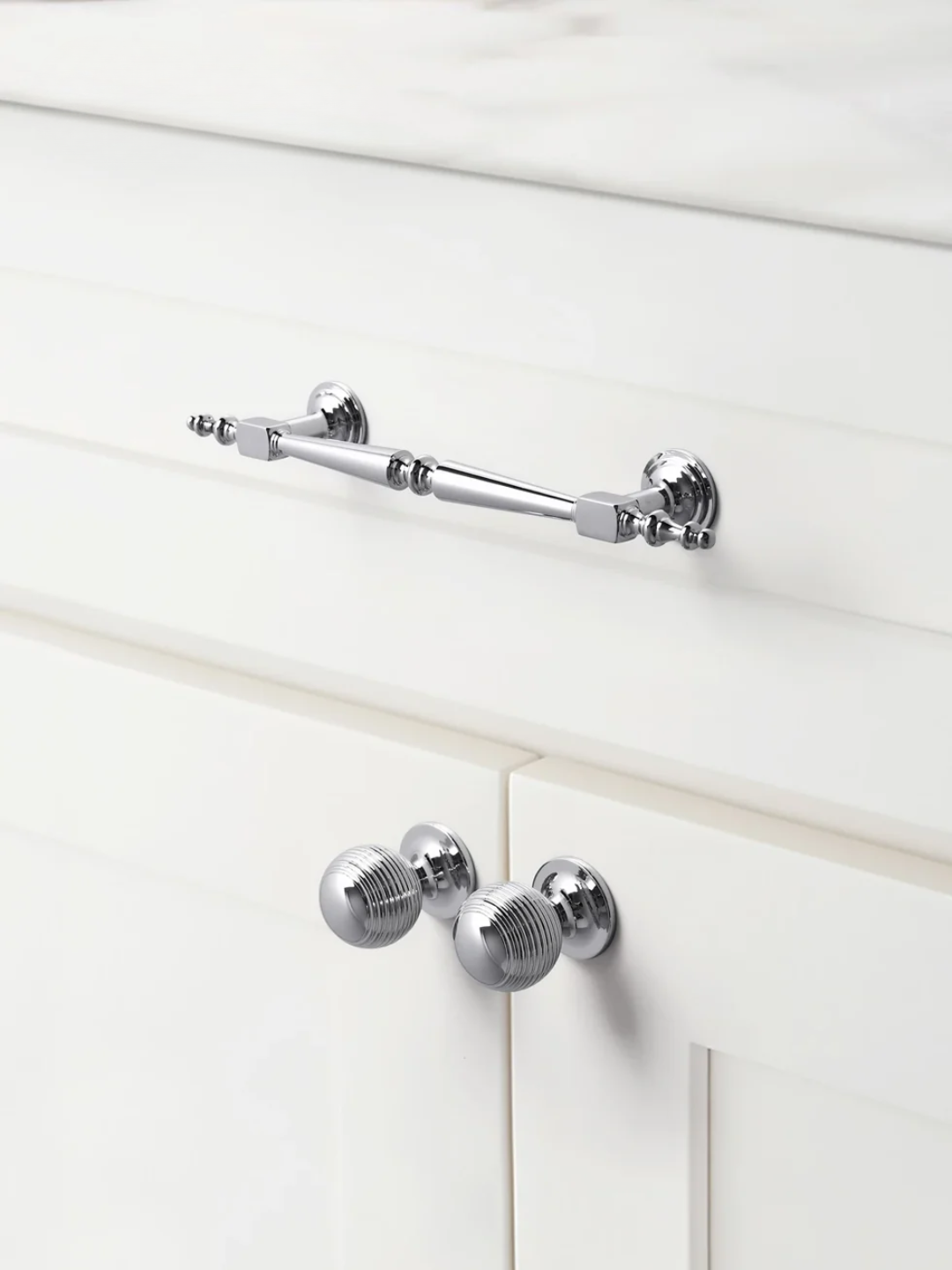 Chrome towel bar mounted on a white wooden wall