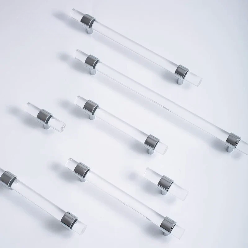 Clear acrylic drawer pulls with silver hardware on a white background