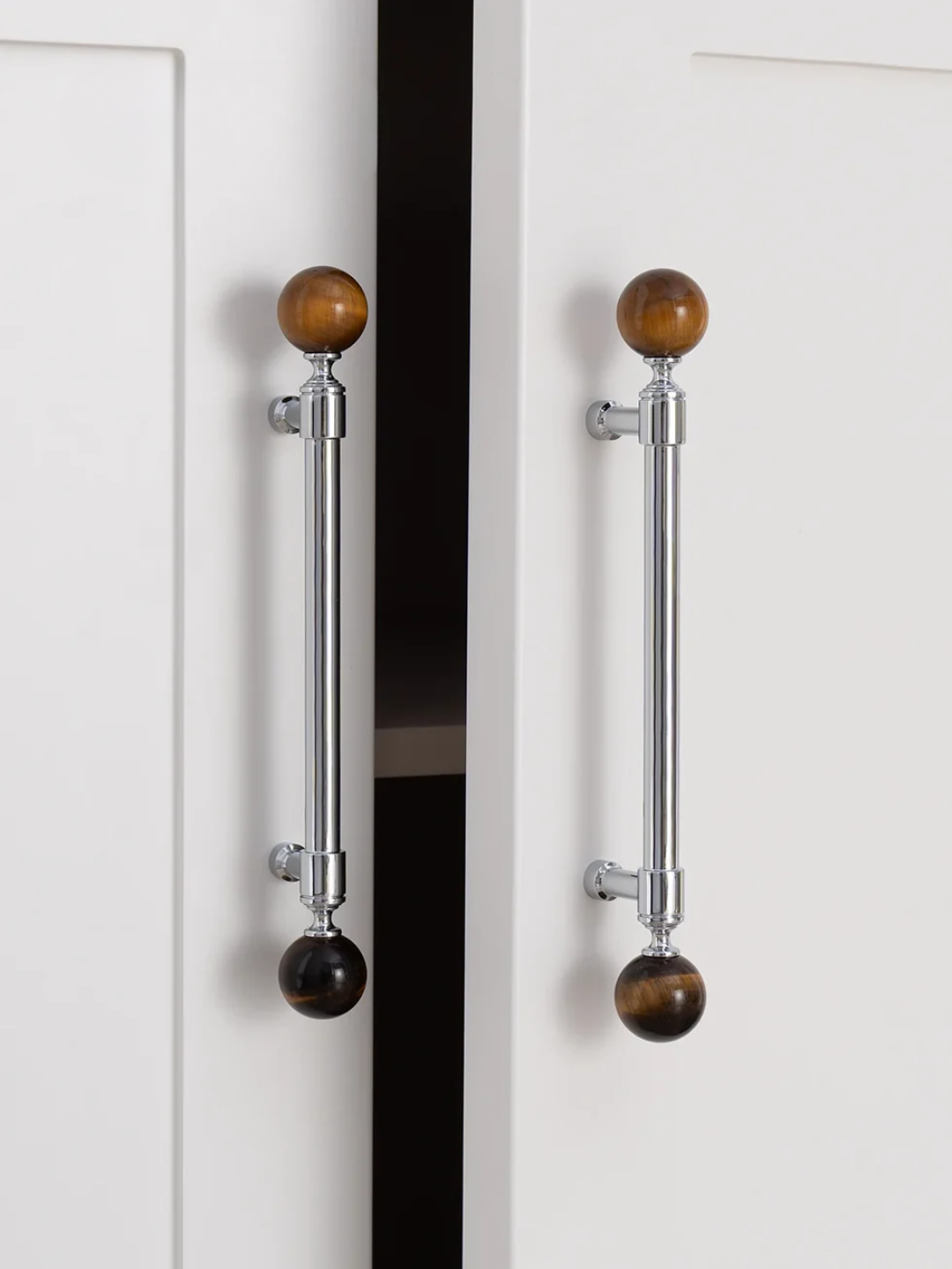 Cabinet doors with wooden knob handles on a white background