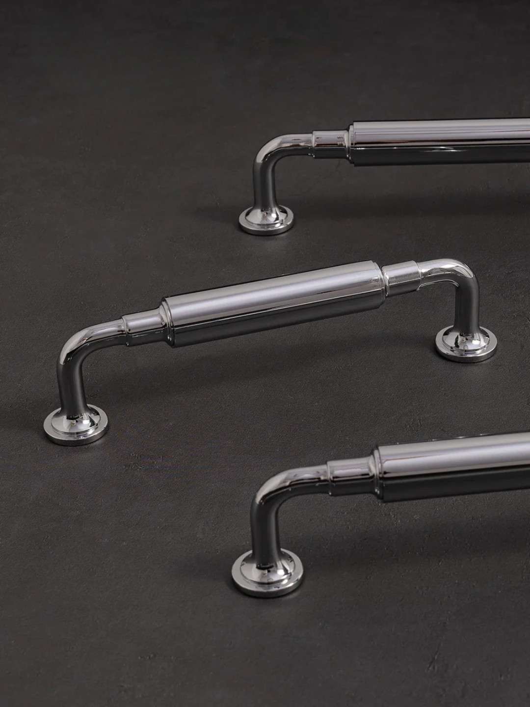 Metallic handles on a dark background