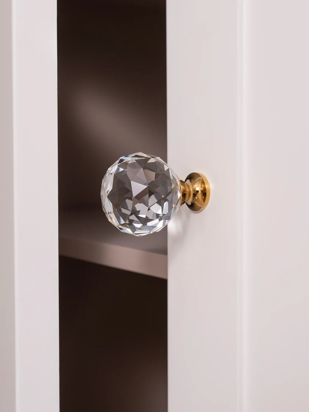 Crystal door handle on a white door