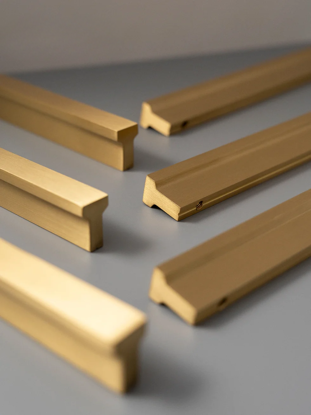 Gold hardware components on a gray surface with 'Santaya' branding.