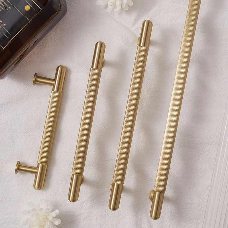Set of gold pen components on a light background