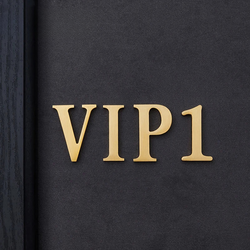 Black surface with gold 'VIP1' text