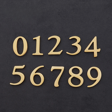 Set of gold metallic numbers on a black background