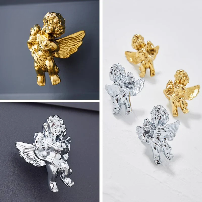 Gold, silver, and crystal angel figurines on a gray and white background