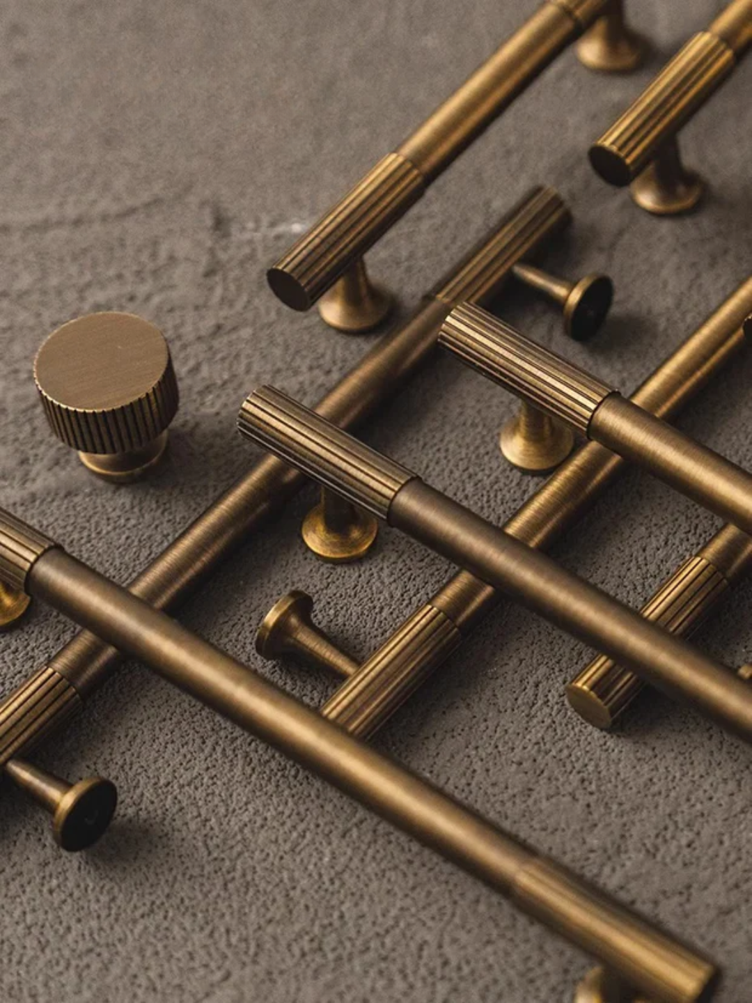 Close-up of a door with gold handles on a light background
