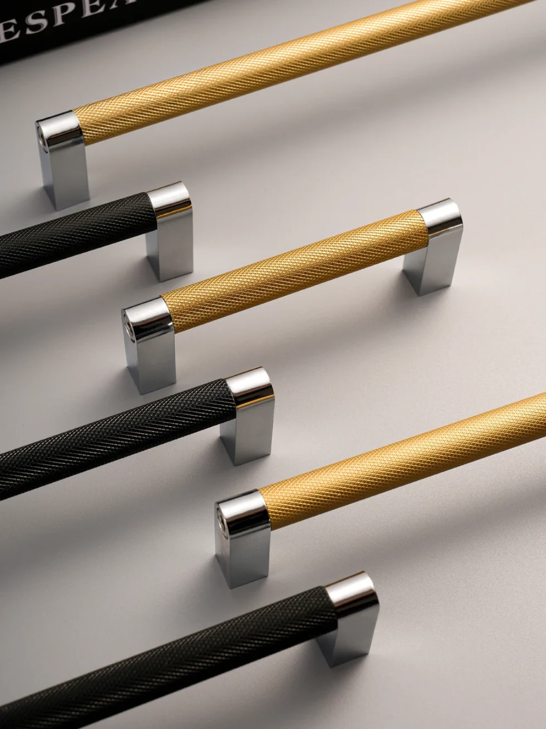 Set of cabinet handles and knobs on a white background