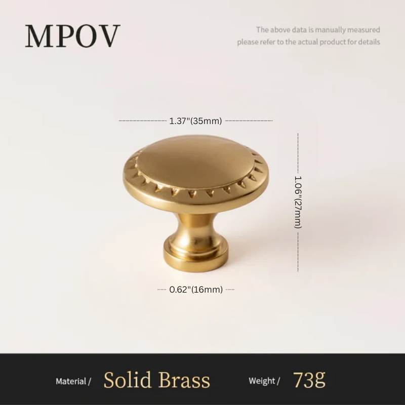 Gold cabinet knob with dimensions and material details on a light background
