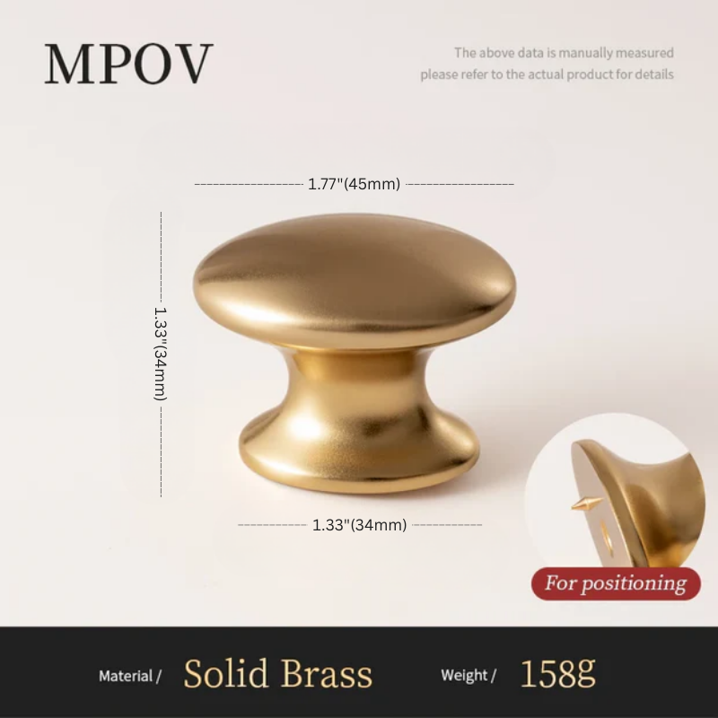 Gold cabinet knob with dimensions and material details on a white background