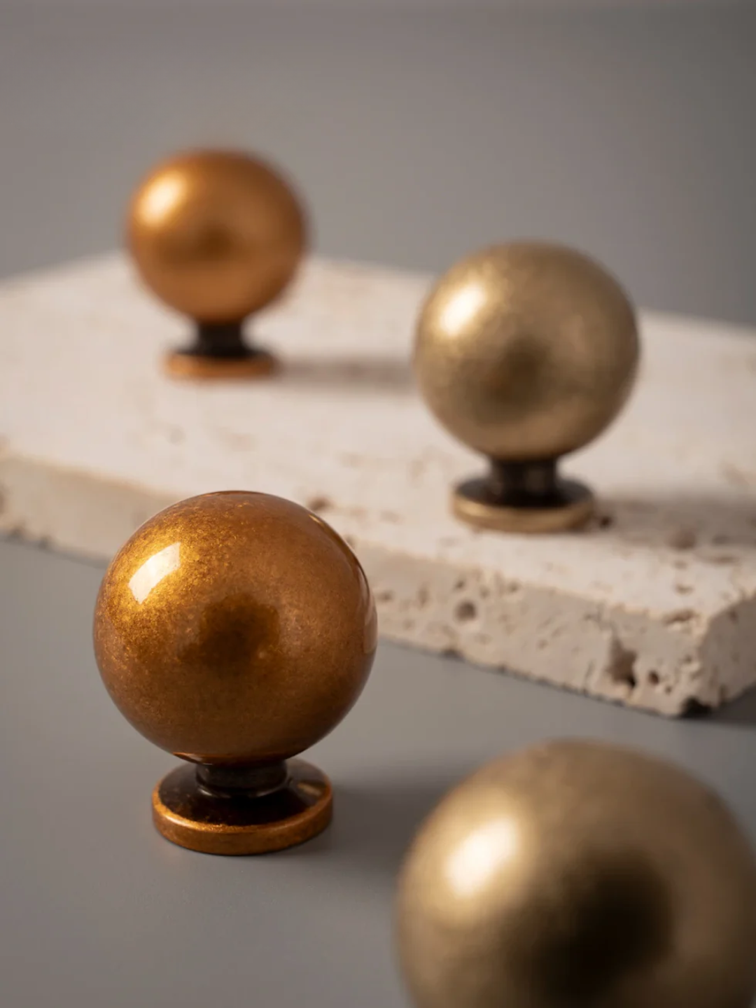 Bronze spherical objects on a textured surface