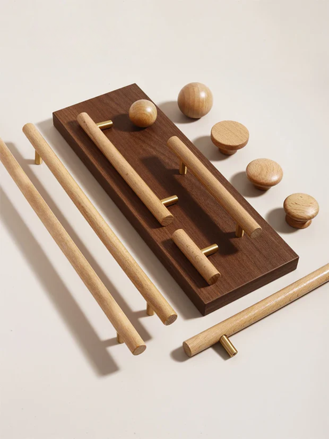 Wooden door handles and knobs on a light background