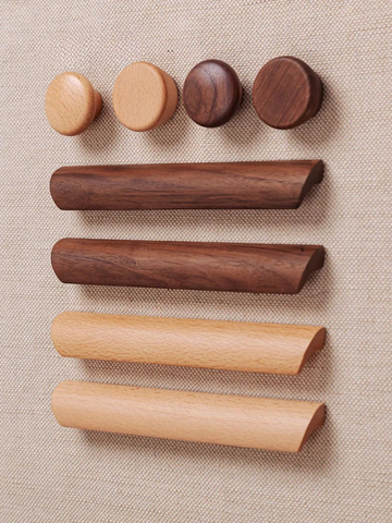 Set of wooden cylindrical objects on a beige fabric background