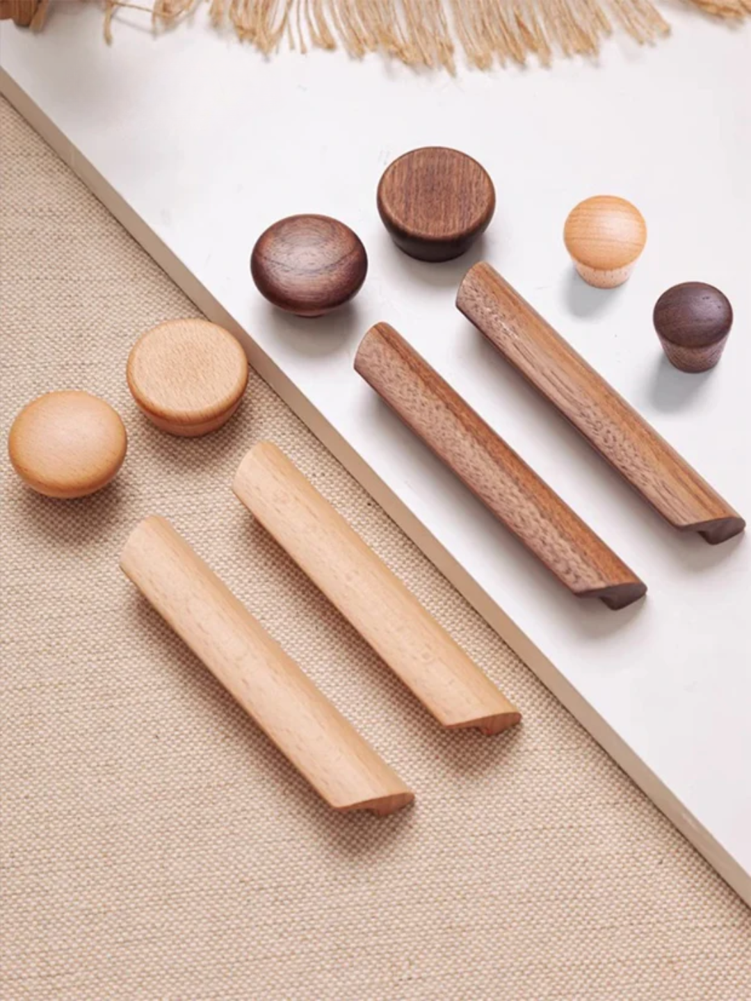 Set of wooden cylindrical objects on a beige fabric background