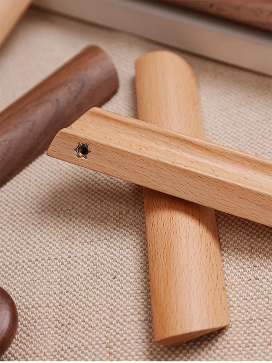Wooden door handle on a textured surface with 'Santaya' branding.