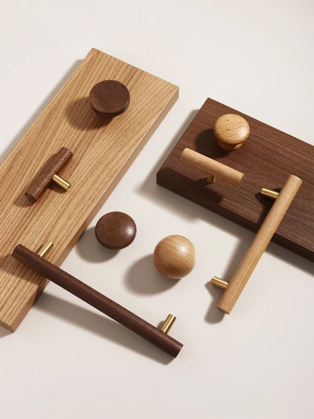 Wooden door handles and knobs on a light background