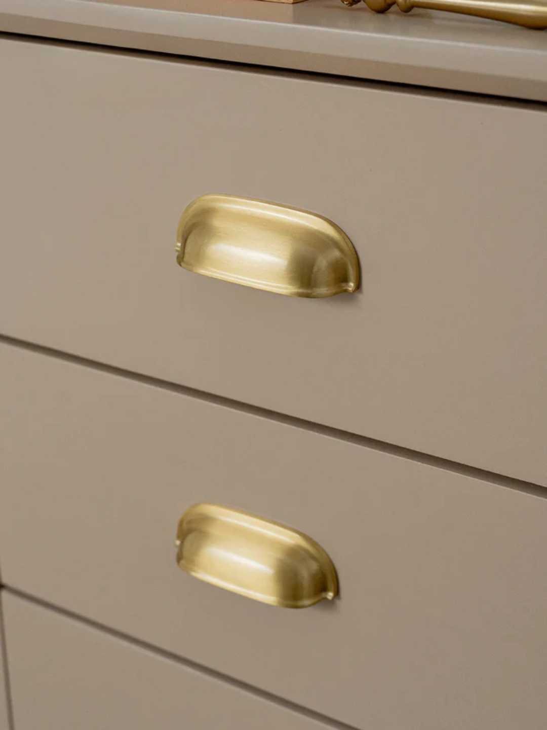 Beige dresser with gold handles