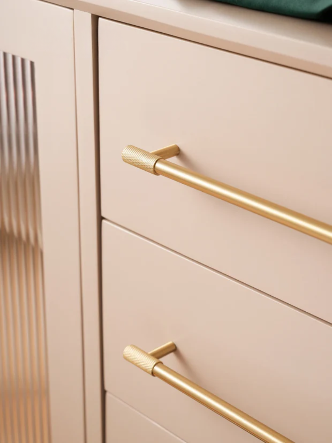 Beige cabinet with gold handles